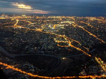 High angle view of illuminated buildings in city at night