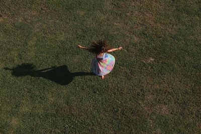 View of a woman spinning from above 