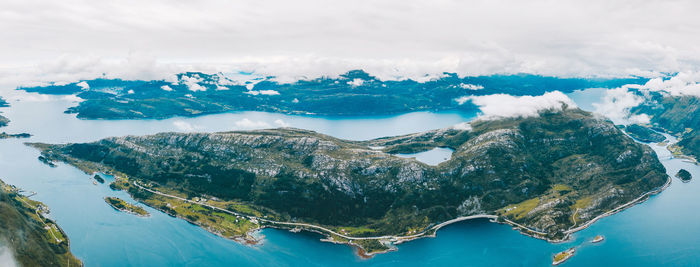 Aerial view of mountain by sea