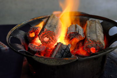 Close-up of burning fire on barbecue grill