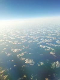 Aerial view of clouds over sea against sky