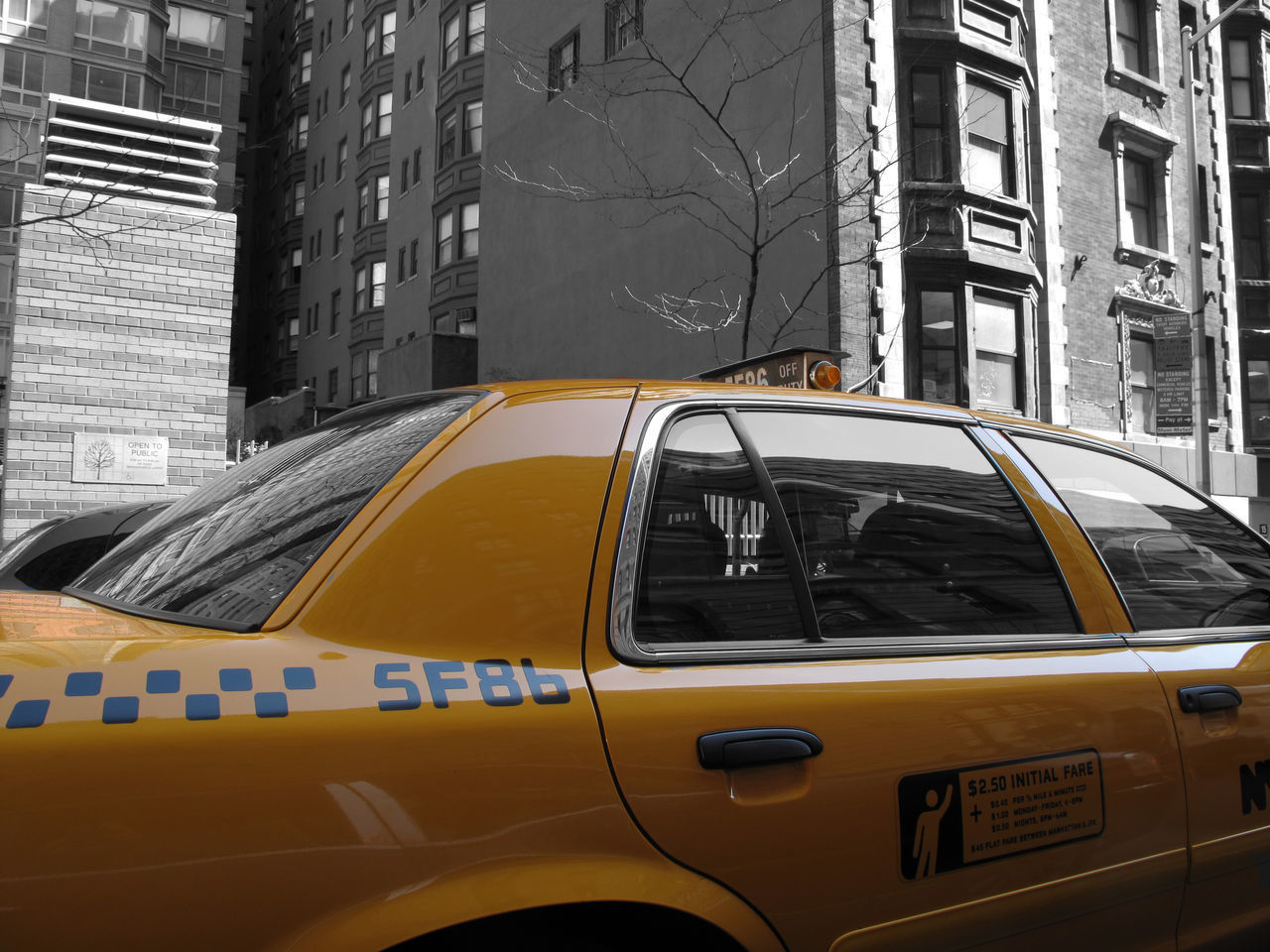 VIEW OF YELLOW CAR ON STREET