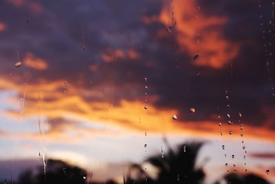 Raindrops on glass window during rainy season