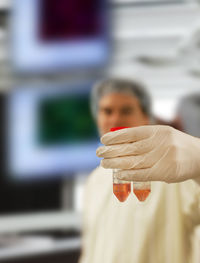 Scientist holding test tubes