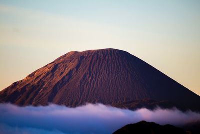 Panoramic view of volcanic mountain against clear sky