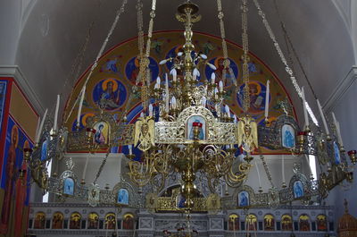 Low angle view of ornate ceiling in temple