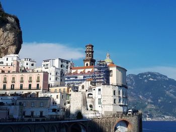 Amalfi's coast.  buildings in city against blue sky