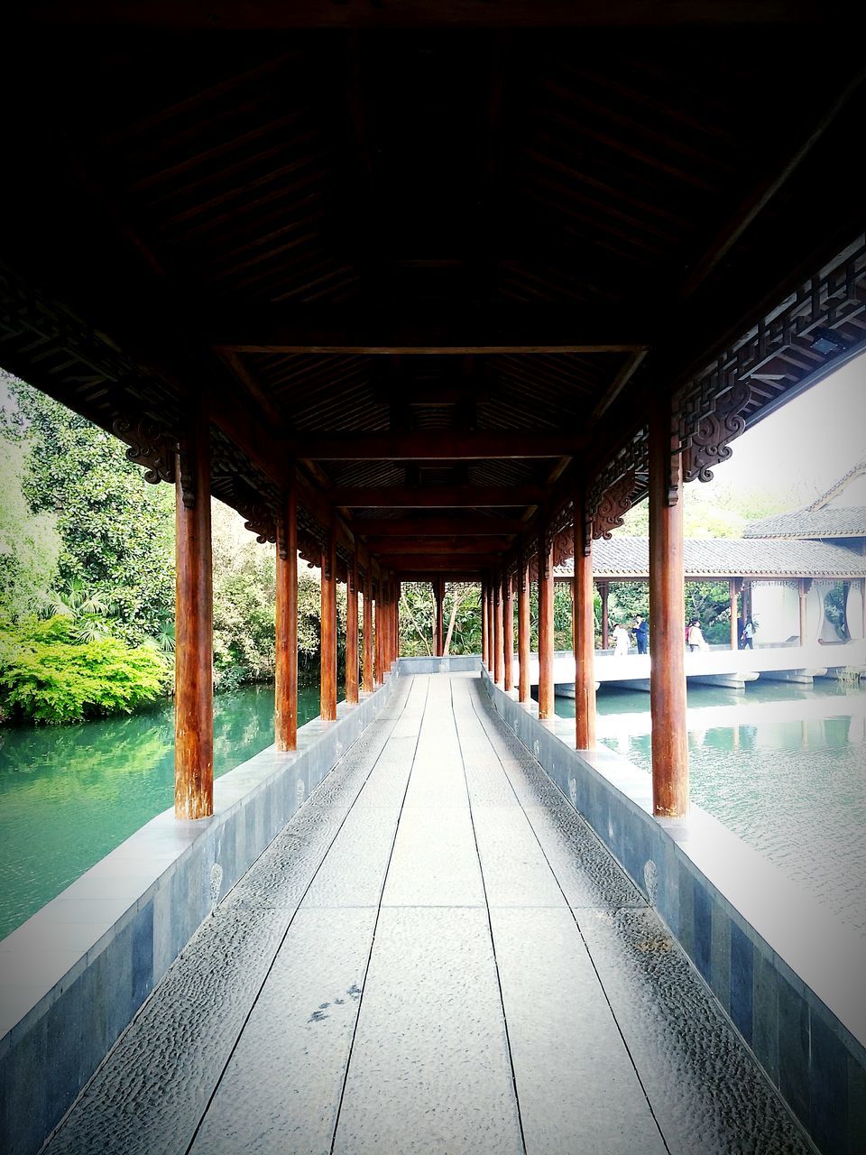 built structure, the way forward, architecture, diminishing perspective, water, pier, vanishing point, long, architectural column, empty, sky, indoors, day, transportation, in a row, sea, railing, wood - material, no people, column