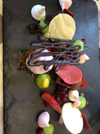 High angle view of multi colored candies on table