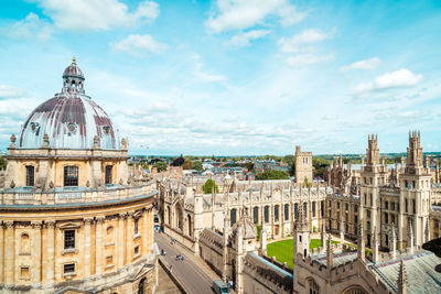 Panoramic view of buildings in city against sky