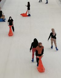 High angle view of people playing in snow