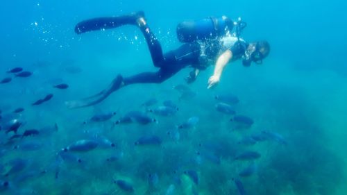 Woman swimming underwater