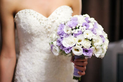 Close-up of woman holding flower