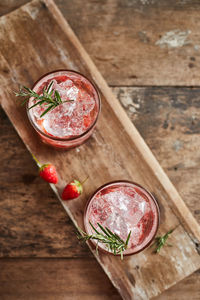 Close-up of drinks on wooden table