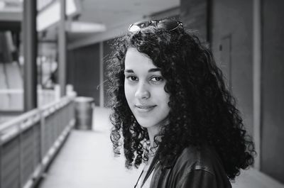 Portrait of young woman with curly hair