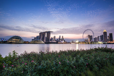 City at waterfront during sunset