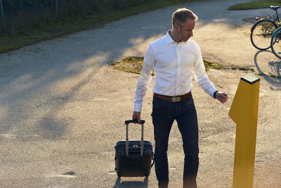 Man buying ticket in ticket machine