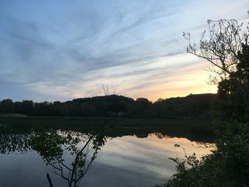 Scenic view of lake against sky during sunset