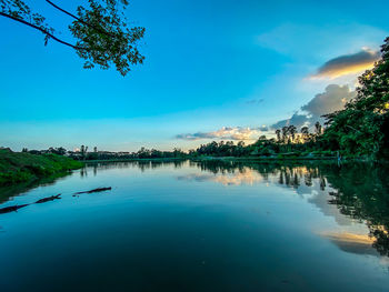 Scenic view of lake against blue sky