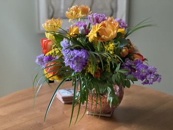 Close-up of purple flower vase on table