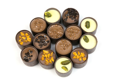 High angle view of candies against white background