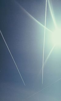 Low angle view of vapor trails in sky