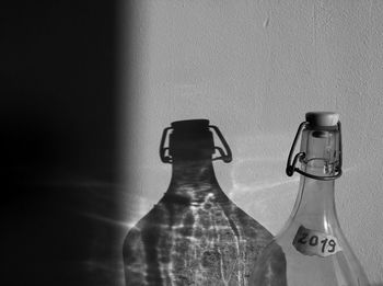 Close-up of glass bottle on table