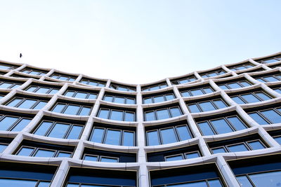 Low angle view of modern building against clear sky