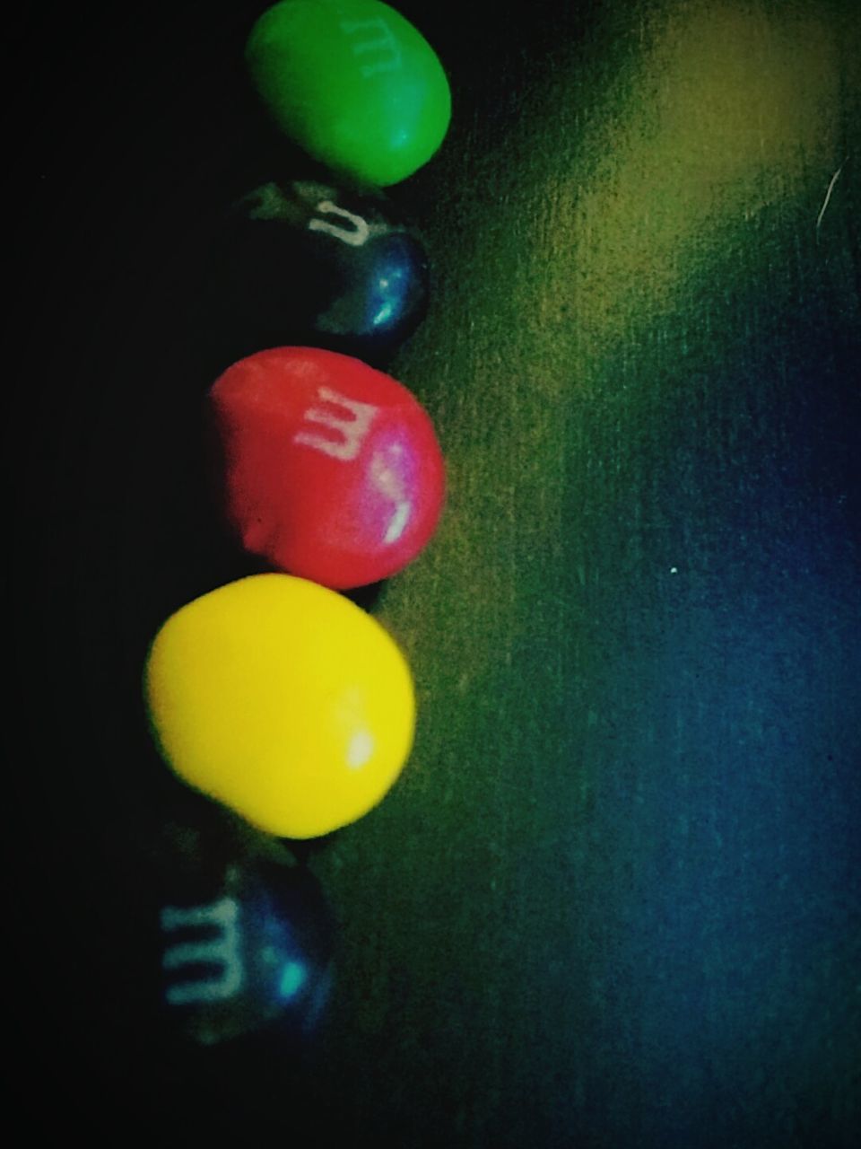 indoors, still life, yellow, close-up, multi colored, high angle view, green color, no people, variation, studio shot, single object, ball, toy, table, red, sport, plastic, fruit, childhood, selective focus