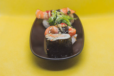 Close-up of sushi served in plate