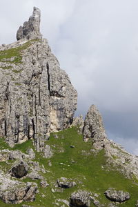 Low angle view of rock formations against sky