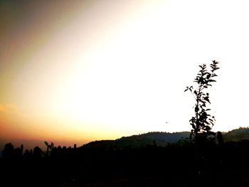 Scenic view of silhouette landscape against clear sky during sunset