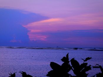 Scenic view of sea against sky at sunset