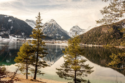 Scenic view of lake and mountains against sky