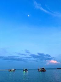 Scenic view of sea against blue sky