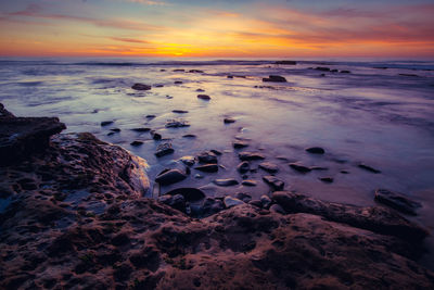 Scenic view of sea against sky during sunset