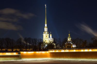 Illuminated building against sky at night