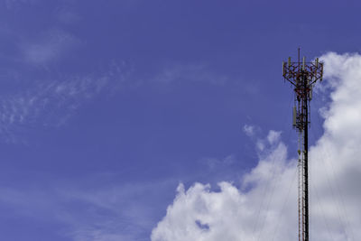 Low angle view of communications tower against sky