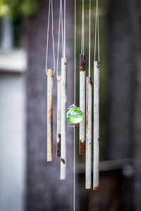 Close-up of rusty wind chime hanging outdoors