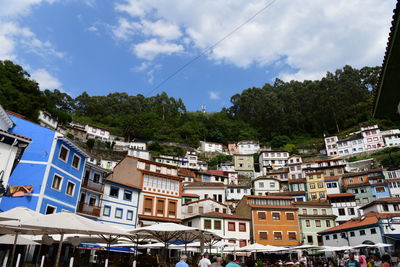 Buildings in city against sky