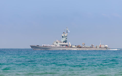 Ship sailing in sea against sky