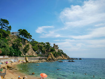 View of beach against cloudy sky