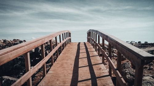 Pier over sea against sky