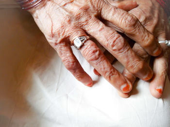 Close-up of woman hand on wall