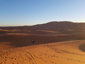 Scenic view of desert against clear sky