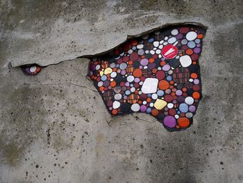 High angle view of multi colored pebbles on sand