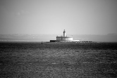 Scenic view of calm sea against blue sky