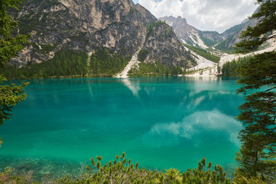 Scenic view of lake and mountains against sky