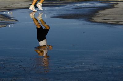 Woman standing on shore