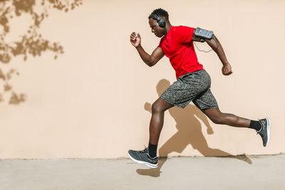 Full length of man running